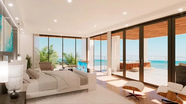 a spacious bedroom with a large window and a bed