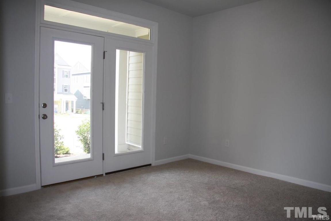 2919 Sunflower Road Apex, NC 27502 - Photo 6 of 34 an empty room with windows
