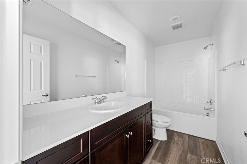 893 Harvest Avenue Upland, CA 91786 - Photo 27 of 40 a bathroom with a sink a toilet and shower