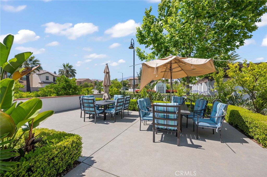 893 Harvest Avenue Upland, CA 91786 - Photo 37 of 40 a view of a patio with a table and chairs under an umbrella