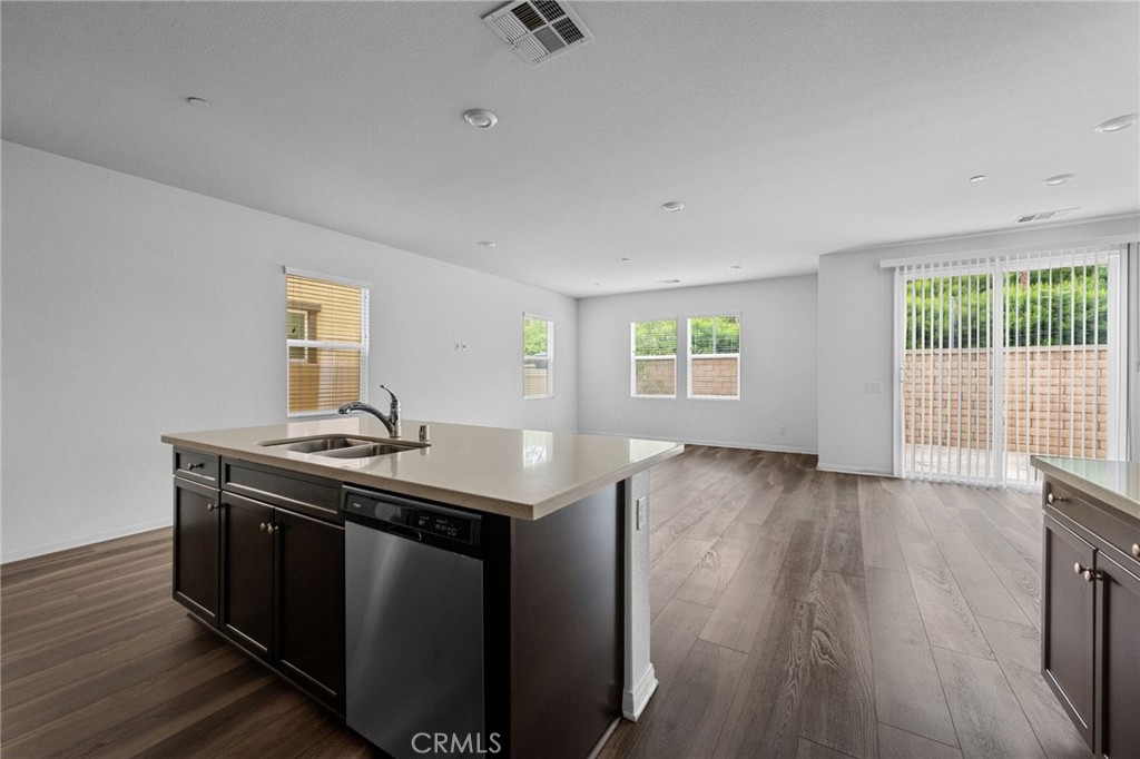 893 Harvest Avenue Upland, CA 91786 - Photo 8 of 40 a kitchen with a stove and wooden floor