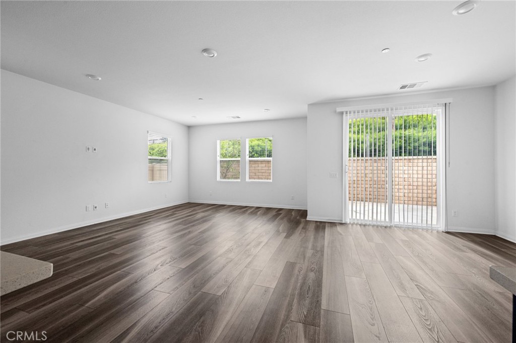893 Harvest Avenue Upland, CA 91786 - Photo 10 of 40 an empty room with wooden floor and windows