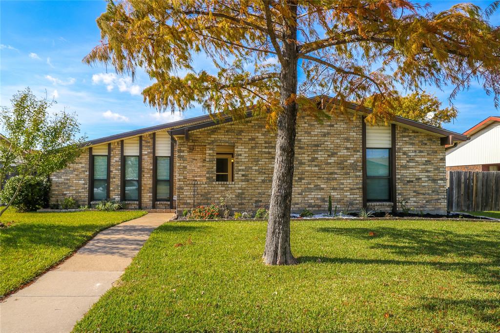 2143 Lymington Road Carrollton, TX 75007 - Photo 1 of 1 a view of a house with a yard