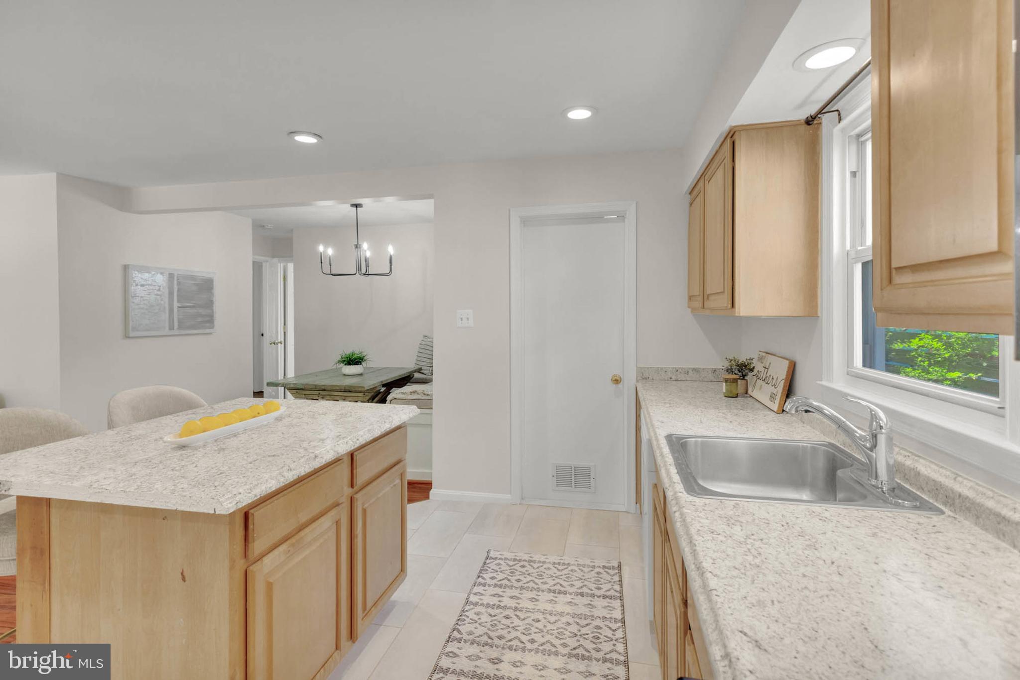 1502 Grange Road Edgewater, MD 21037 - Photo 11 of 43 a bathroom with a granite countertop sink a bathtub a mirror and vanity