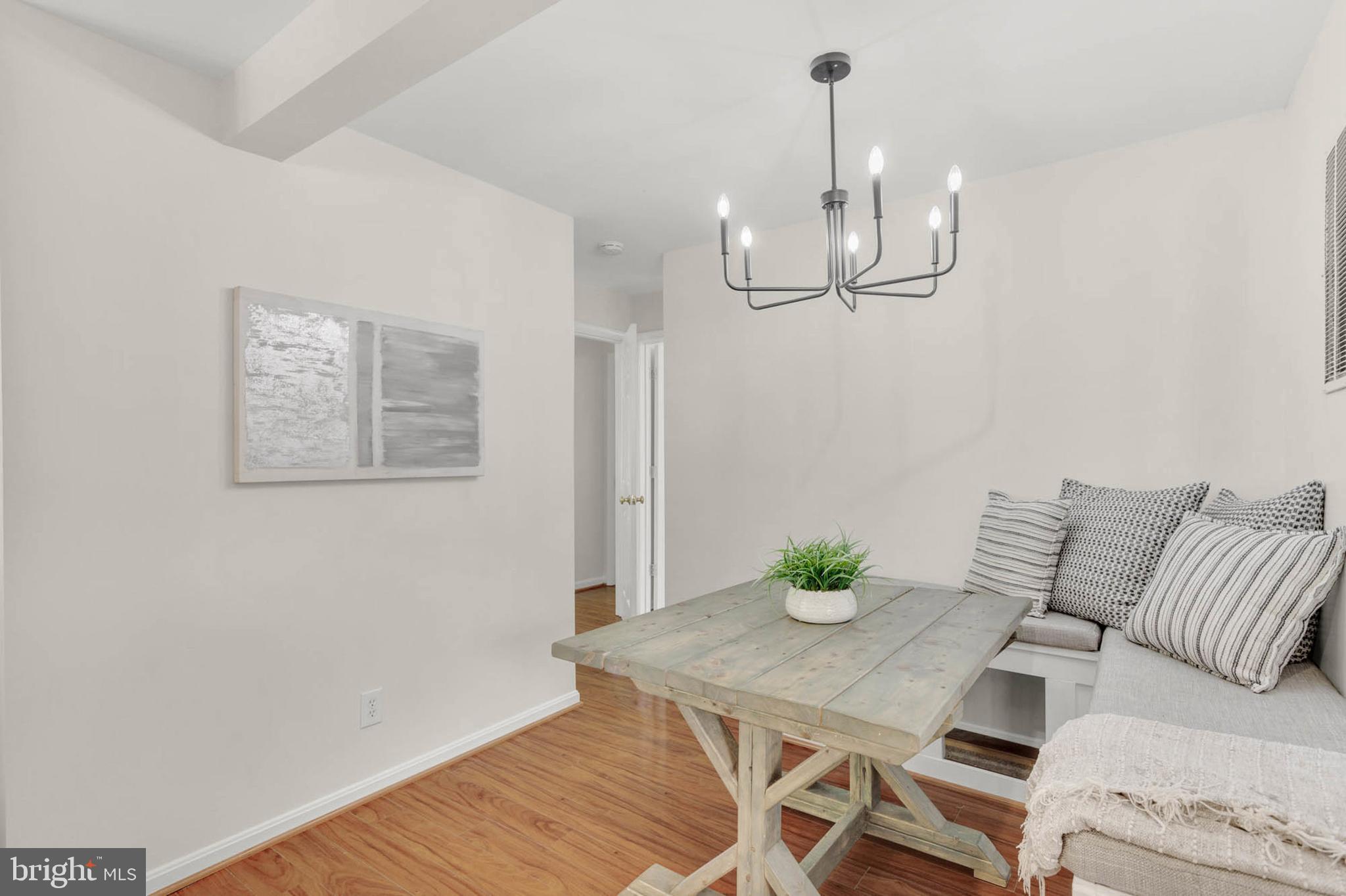 1502 Grange Road Edgewater, MD 21037 - Photo 13 of 43 a view of a dining room with furniture wooden floor and chandelier