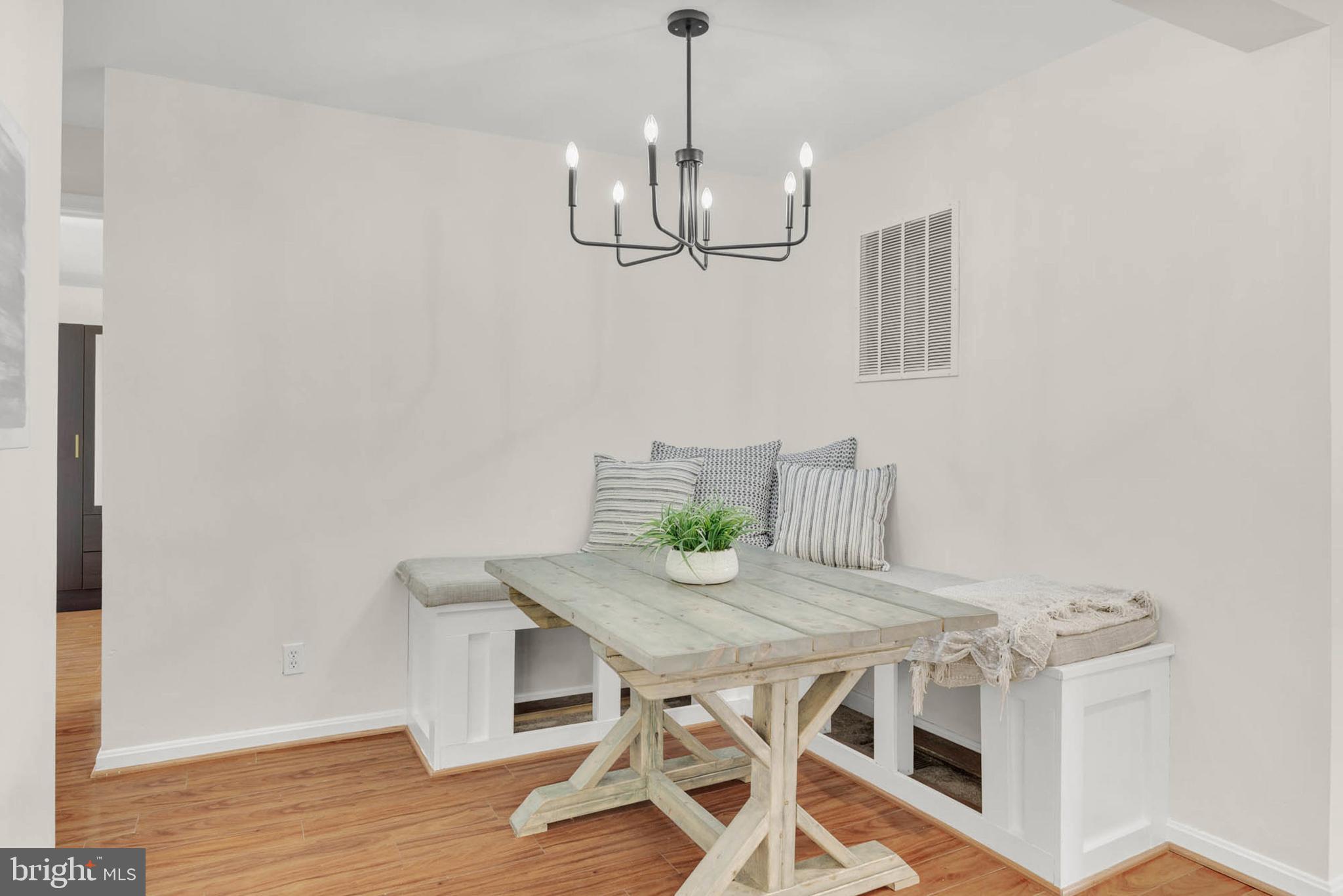 1502 Grange Road Edgewater, MD 21037 - Photo 14 of 43 a view of a dining room with furniture and wooden floor