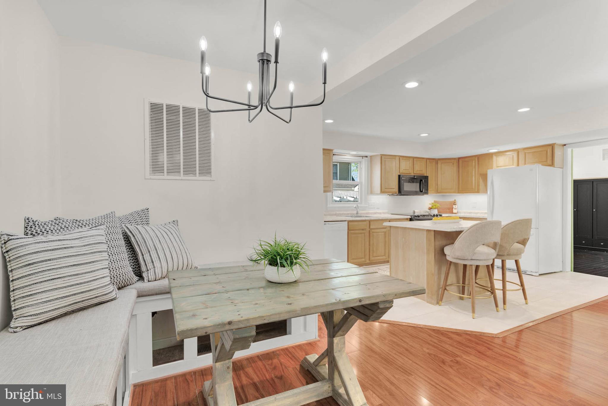 1502 Grange Road Edgewater, MD 21037 - Photo 15 of 43 a dinning room and kitchen view with a table chairs