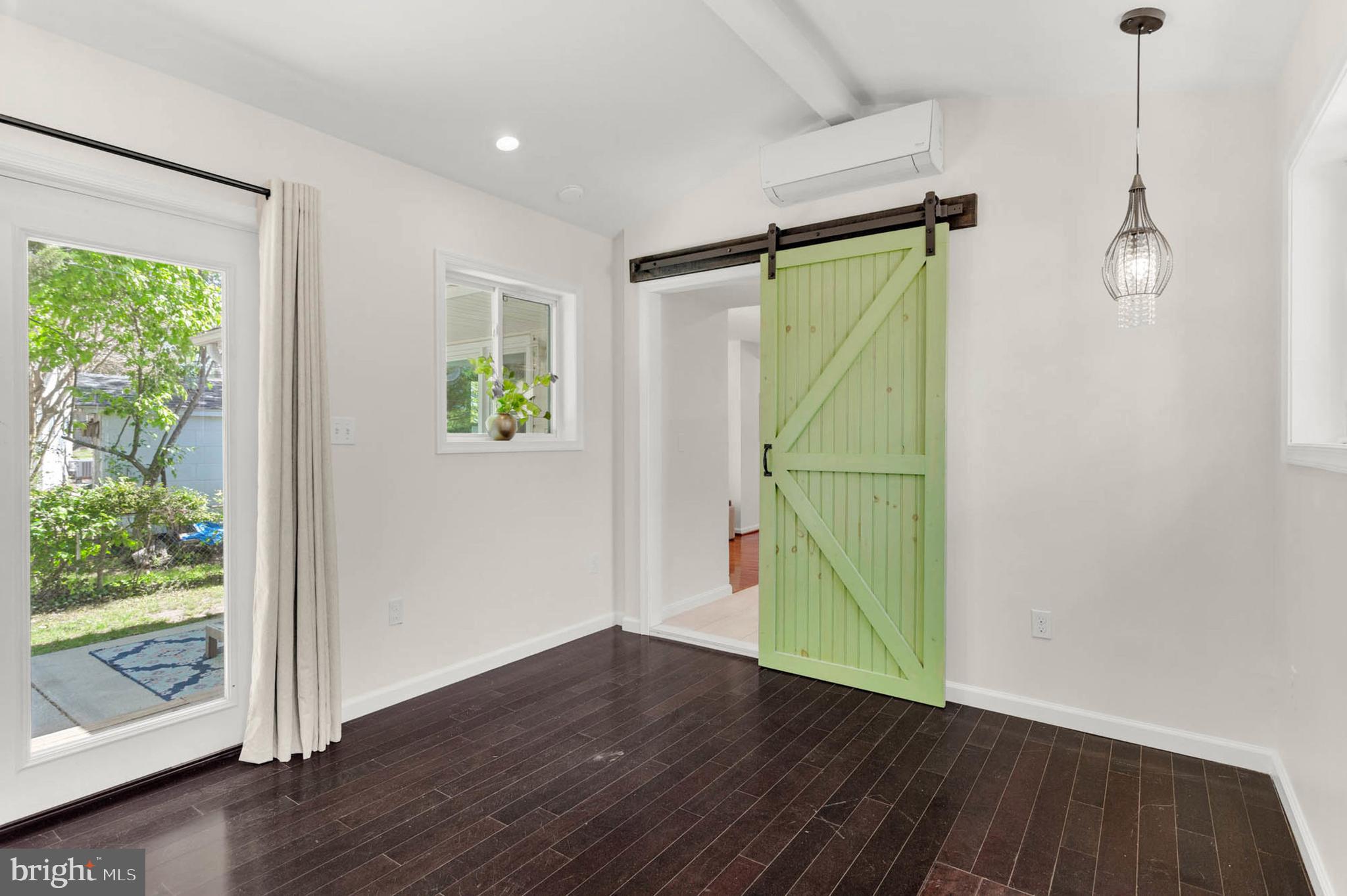 1502 Grange Road Edgewater, MD 21037 - Photo 17 of 43 a view of an empty room with wooden floor and a window