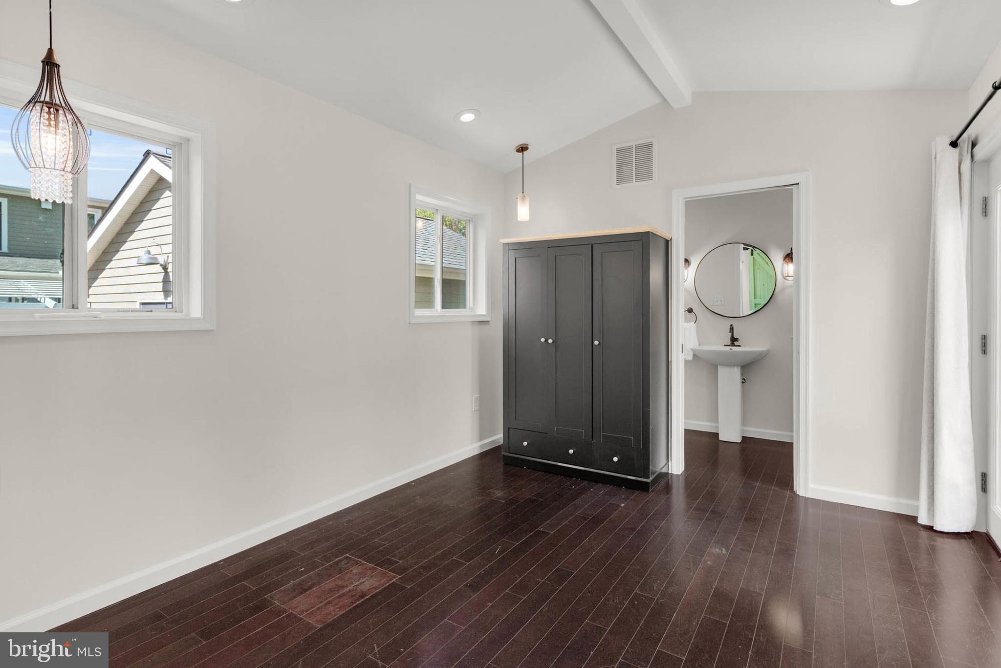 1502 Grange Road Edgewater, MD 21037 - Photo 18 of 43 a view of an empty room with wooden floor and a window