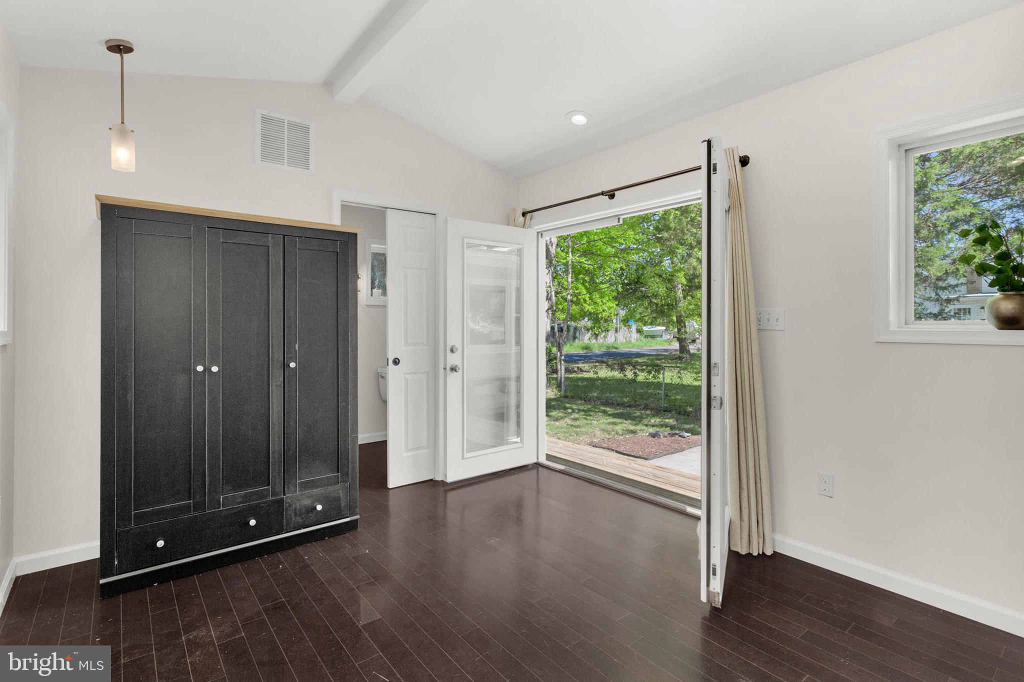 1502 Grange Road Edgewater, MD 21037 - Photo 19 of 43 a view of an empty room with wooden floor and window