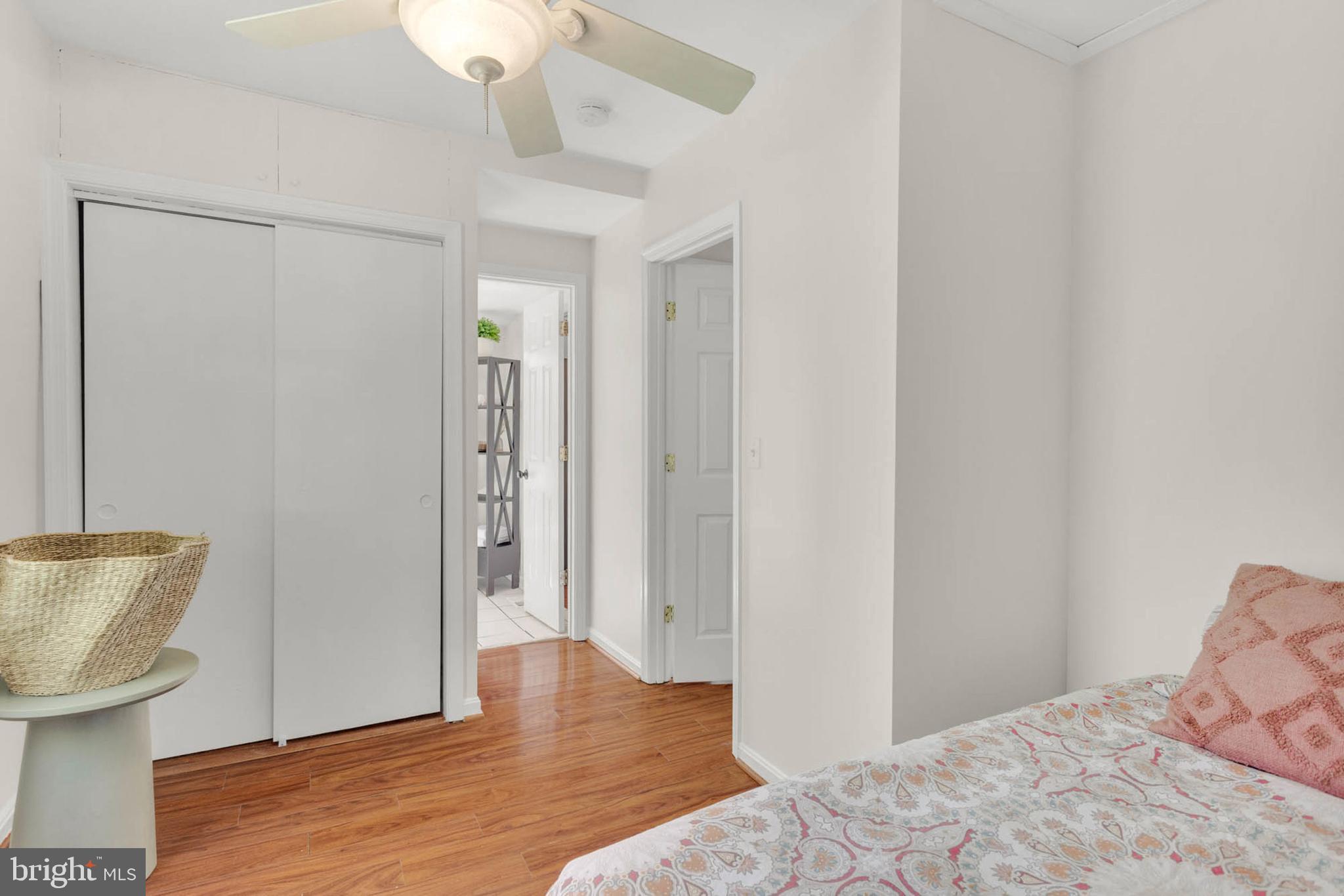 1502 Grange Road Edgewater, MD 21037 - Photo 23 of 43 a view of a bedroom with wooden floor fan and a bathroom