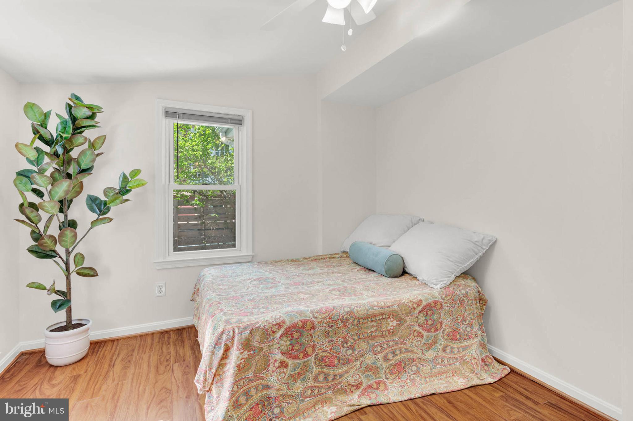 1502 Grange Road Edgewater, MD 21037 - Photo 24 of 43 a bedroom with a bed and a window