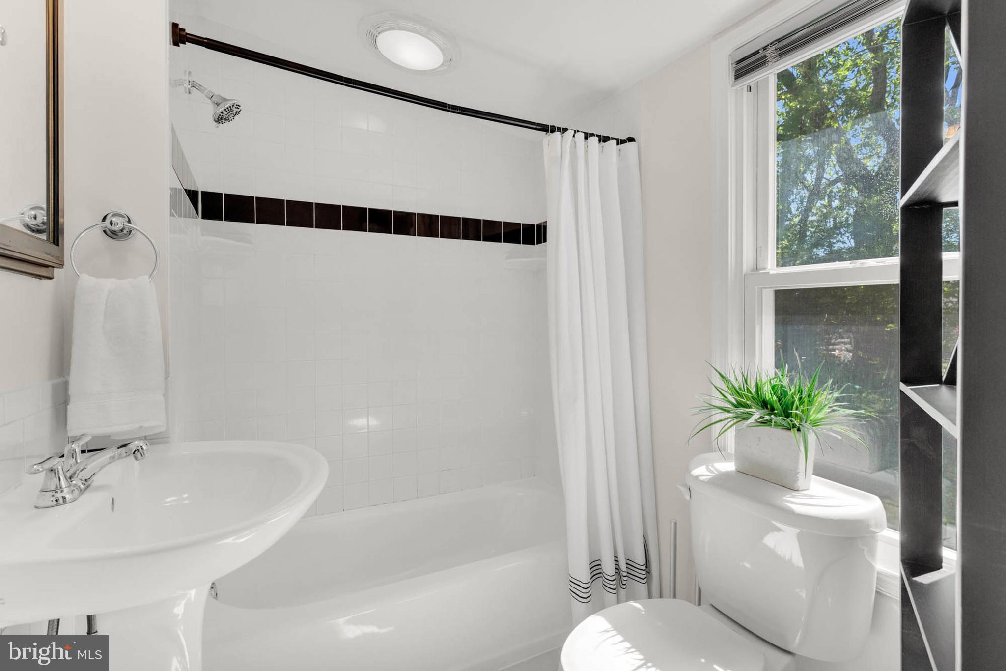 1502 Grange Road Edgewater, MD 21037 - Photo 26 of 43 a bathroom with a shower and a tub