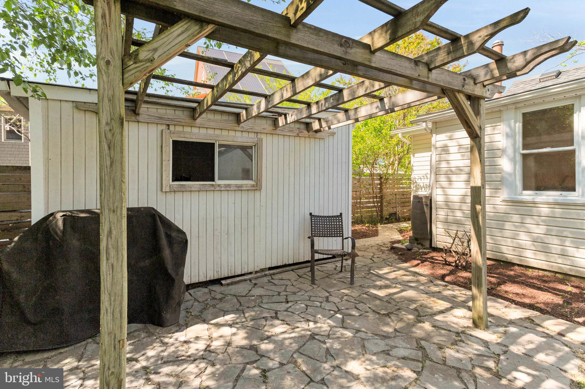 1502 Grange Road Edgewater, MD 21037 - Photo 28 of 43 a view of a porch with furniture and a gate