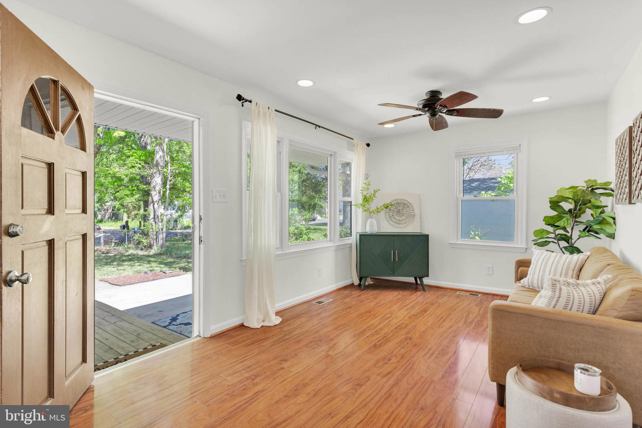 1502 Grange Road Edgewater, MD 21037 - Photo 4 of 43 a bedroom with a bed and a large window