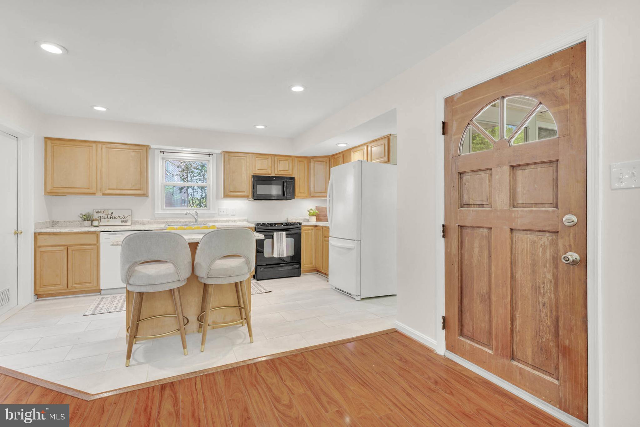 1502 Grange Road Edgewater, MD 21037 - Photo 8 of 43 a living room with stainless steel appliances kitchen island granite countertop furniture and a wooden floor