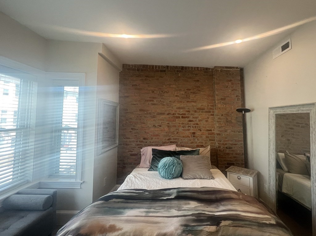 159 Bennington Street, Unit 2 Boston, MA 02128 - Photo 11 of 20 a view of a livingroom with couch and a window