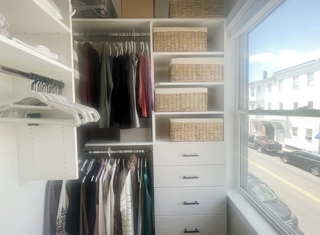 159 Bennington Street, Unit 2 Boston, MA 02128 - Photo 12 of 20 a view of walk in closet with clothes and shoes