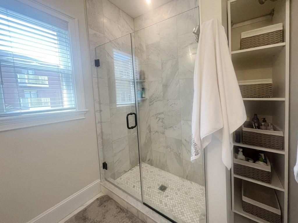 159 Bennington Street, Unit 2 Boston, MA 02128 - Photo 8 of 20 a bathroom with a shower and a window