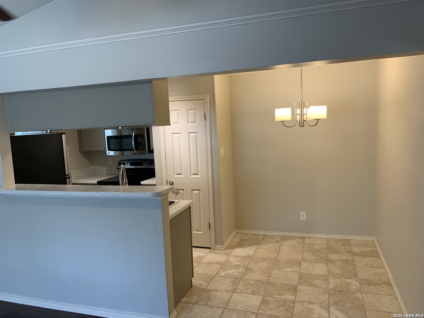 11610 Vance Jackson Road, Unit 628 San Antonio, TX 78230 - Photo 3 of 4 a kitchen with stainless steel appliances a refrigerator and a stove