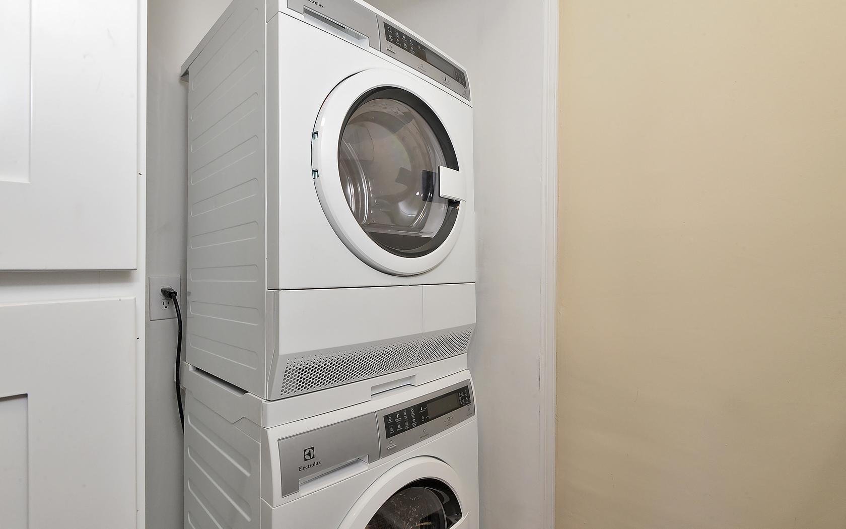 235 Monroe Street, Unit 9 Hoboken, NJ 07030 - Photo 4 of 15 a utility room with dryer and washer