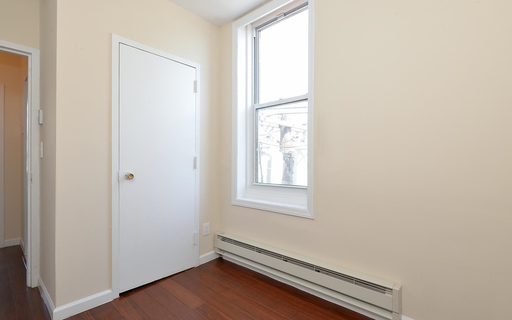 235 Monroe Street, Unit 9 Hoboken, NJ 07030 - Photo 10 of 15 an empty room with windows