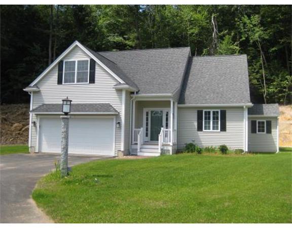 7 Reed Lane, Unit LOT 5 Littleton, MA 01460 - Photo 2 of 7 a front view of a house with a yard and porch