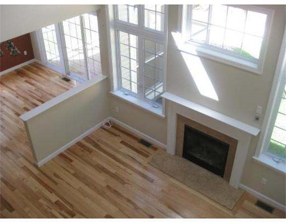 7 Reed Lane, Unit LOT 5 Littleton, MA 01460 - Photo 4 of 7 a view of an empty room with wooden floor and a window