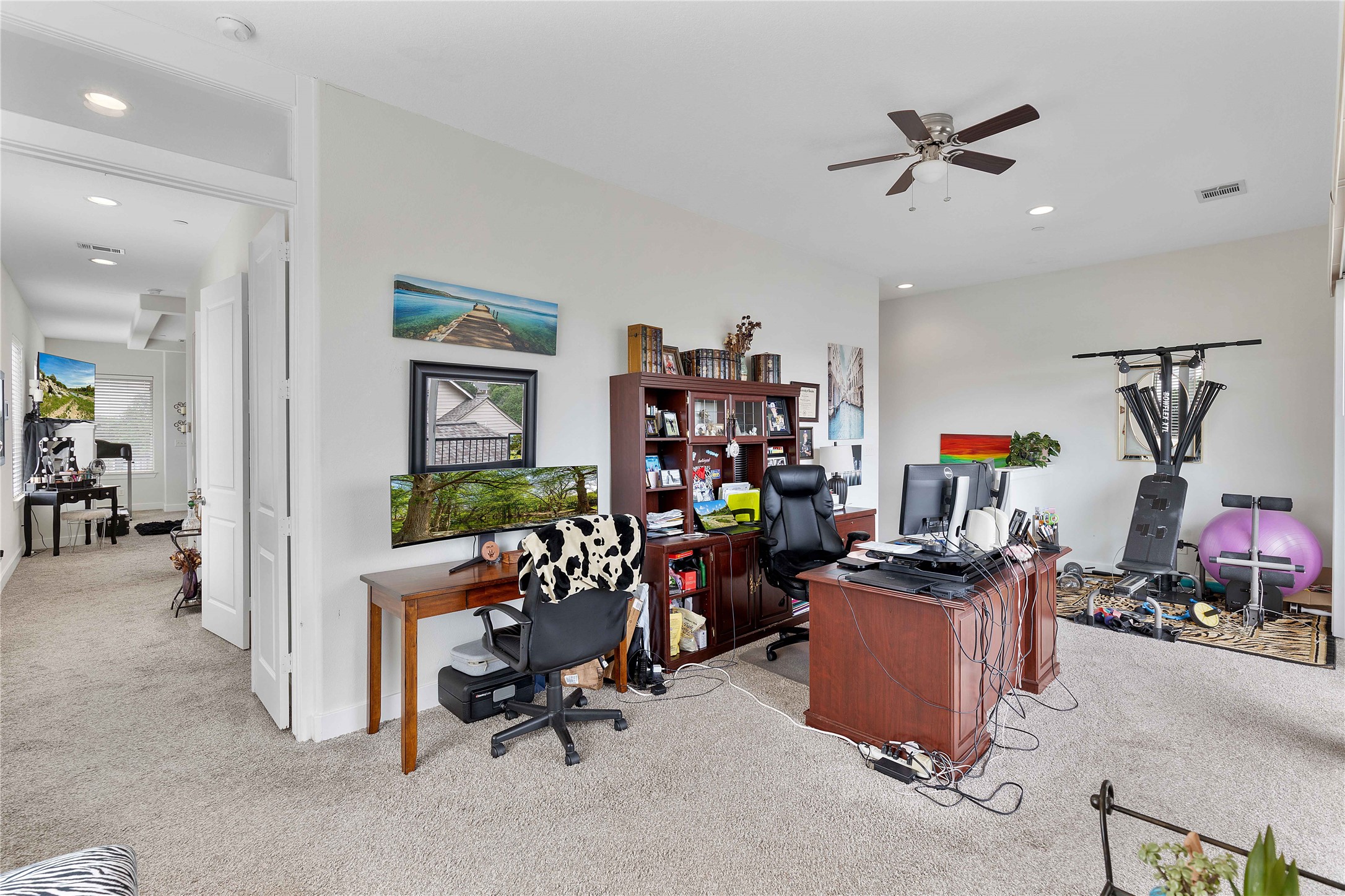 11434 Ketch Court Willis, TX 77318 - Photo 14 of 50 a view of a workspace with furniture and a livingroom