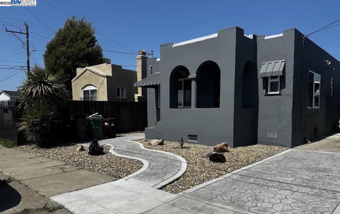 7808 Weld Street Oakland, CA 94621 - Photo 1 of 8 a view of a house with a yard