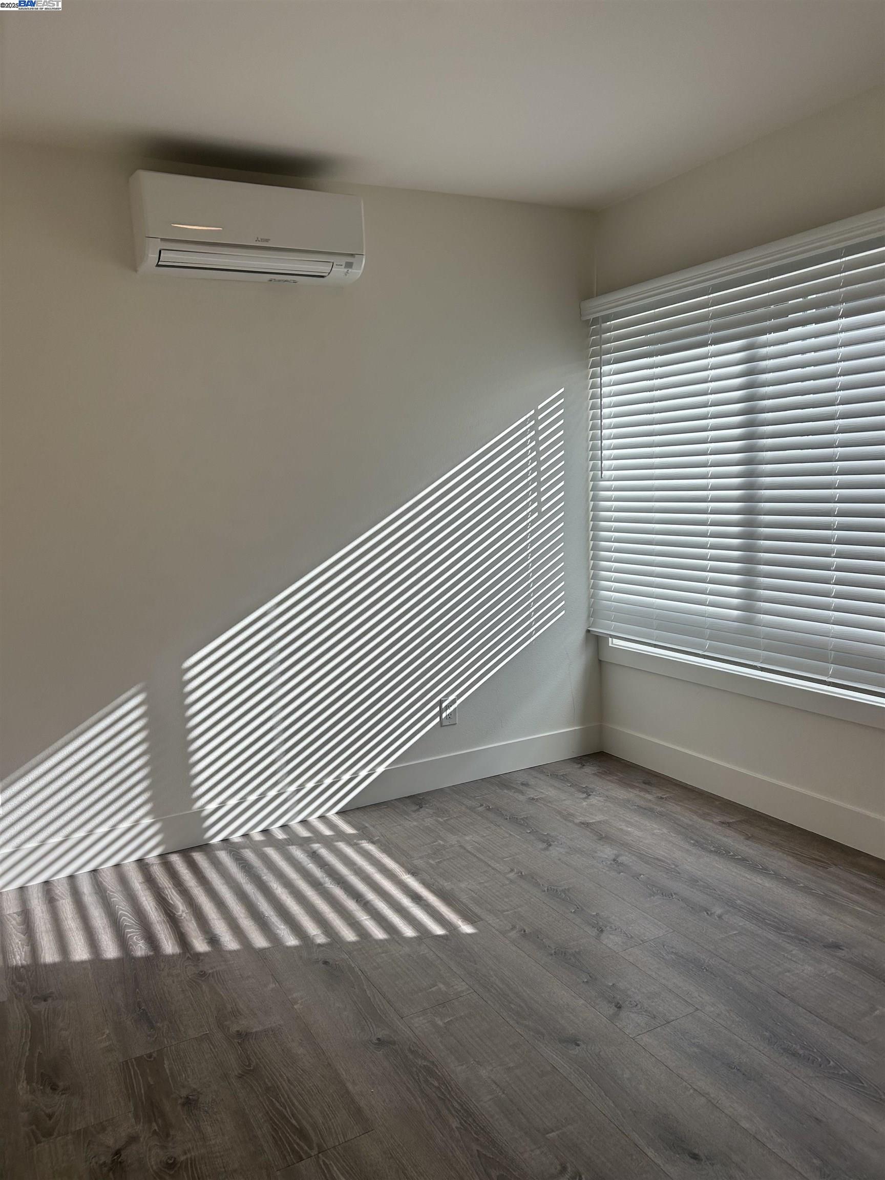 7808 Weld Street Oakland, CA 94621 - Photo 8 of 8 a view of a room with wooden floor and a window