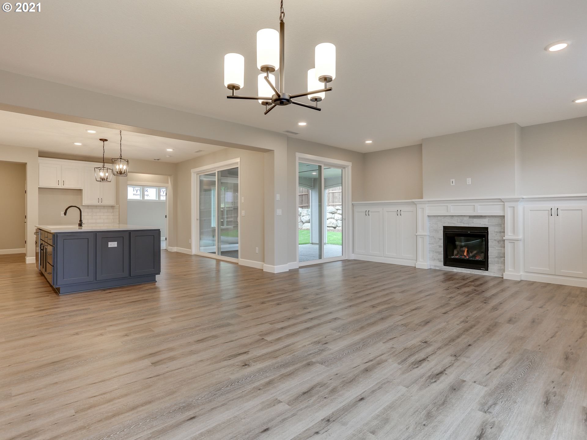 4128 South 17th Way Ridgefield, WA 98642 - Photo 11 of 21 a view of empty room with wooden floor and fireplace
