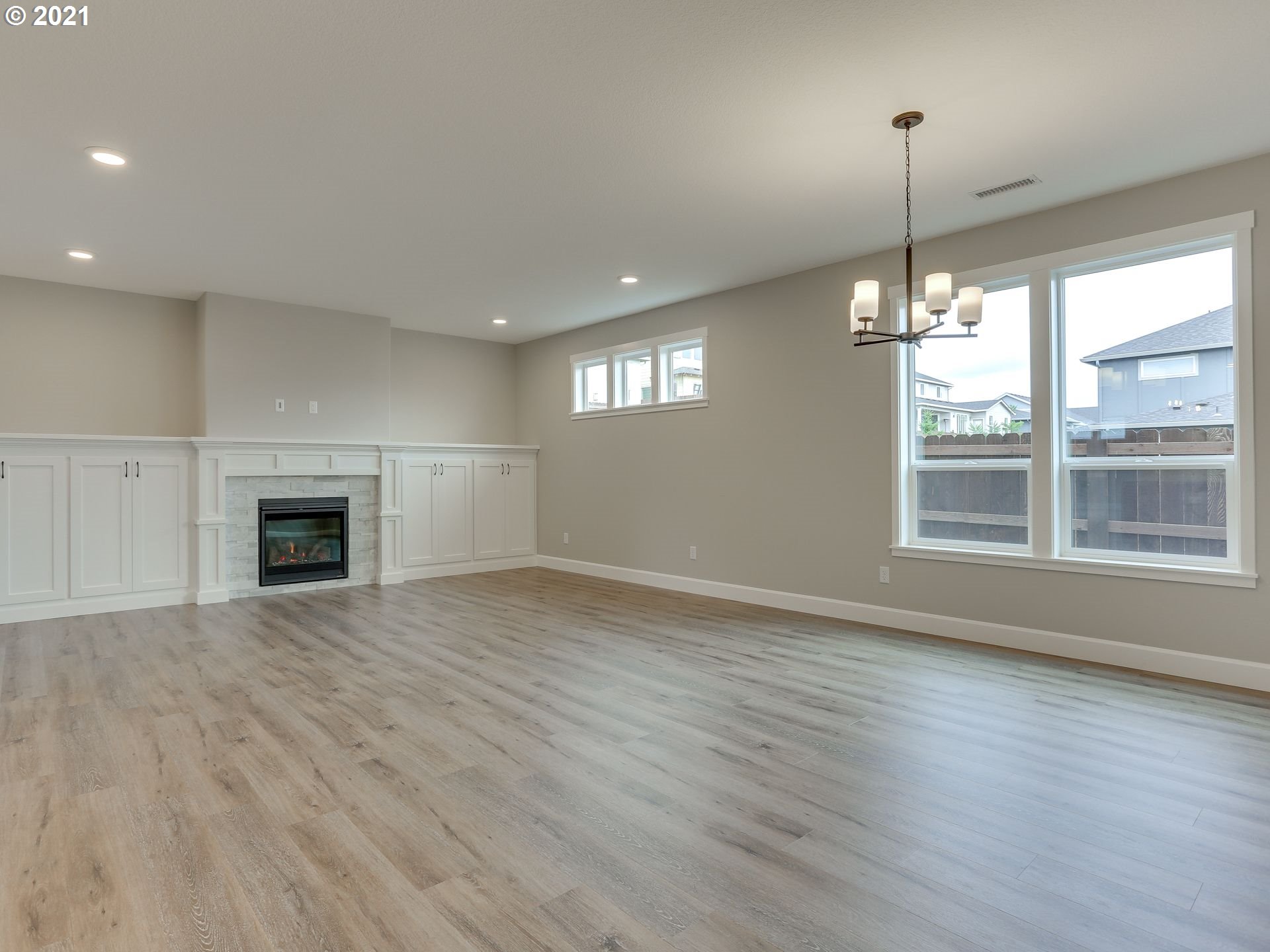4128 South 17th Way Ridgefield, WA 98642 - Photo 12 of 21 a view of an empty room with window and wooden floor