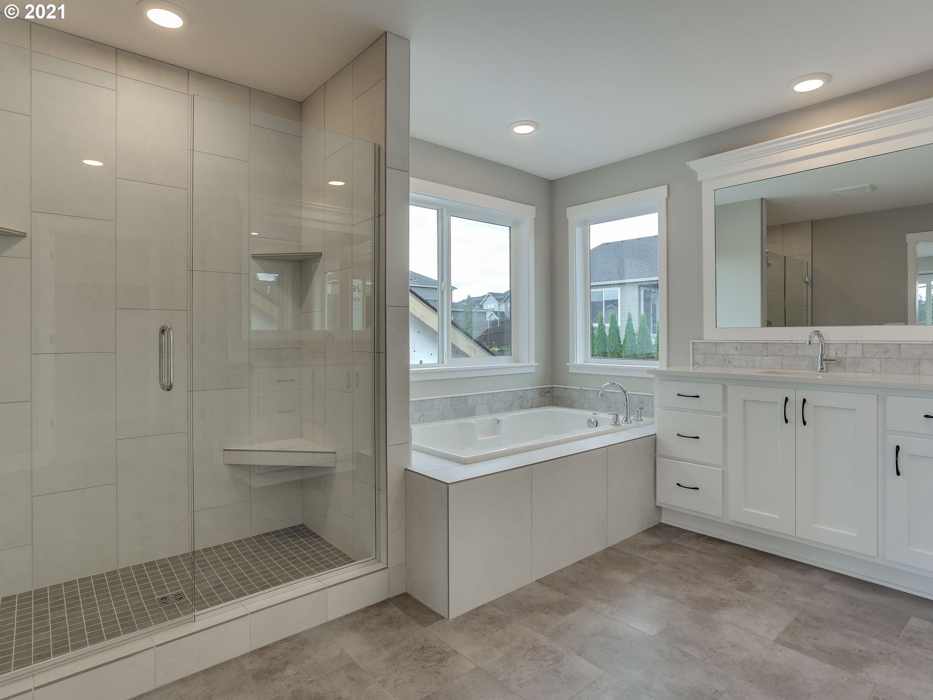 4128 South 17th Way Ridgefield, WA 98642 - Photo 16 of 21 a bathroom with a granite countertop sink mirror bathtub and toilet