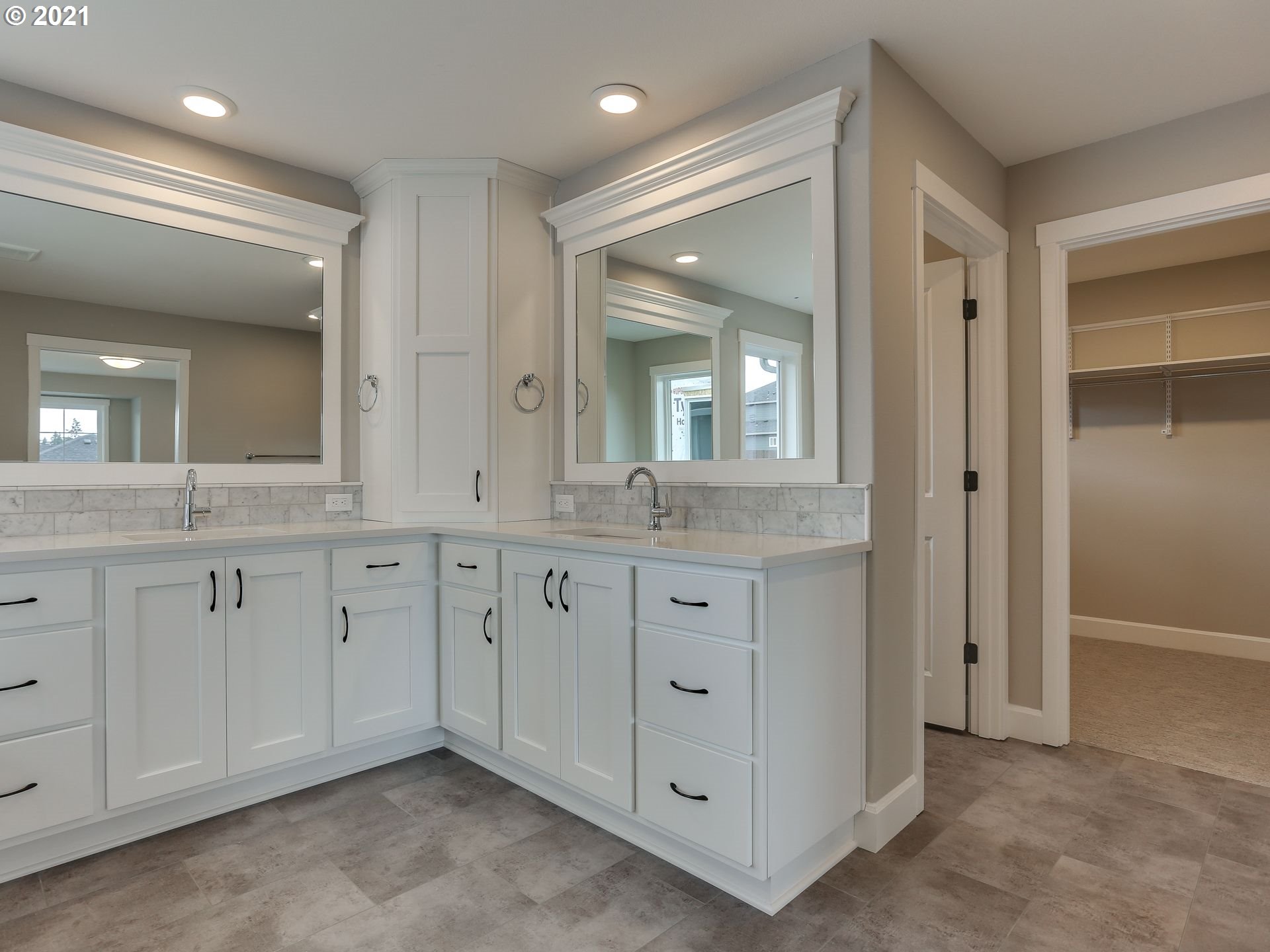 4128 South 17th Way Ridgefield, WA 98642 - Photo 17 of 21 a spacious bathroom with double vanity a mirror a vanity and a