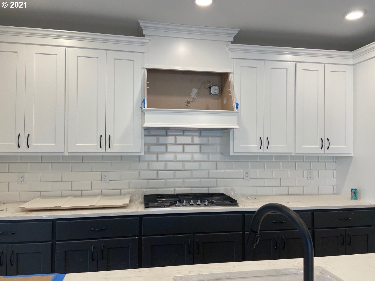 4128 South 17th Way Ridgefield, WA 98642 - Photo 5 of 21 a kitchen with granite countertop white cabinets and sink
