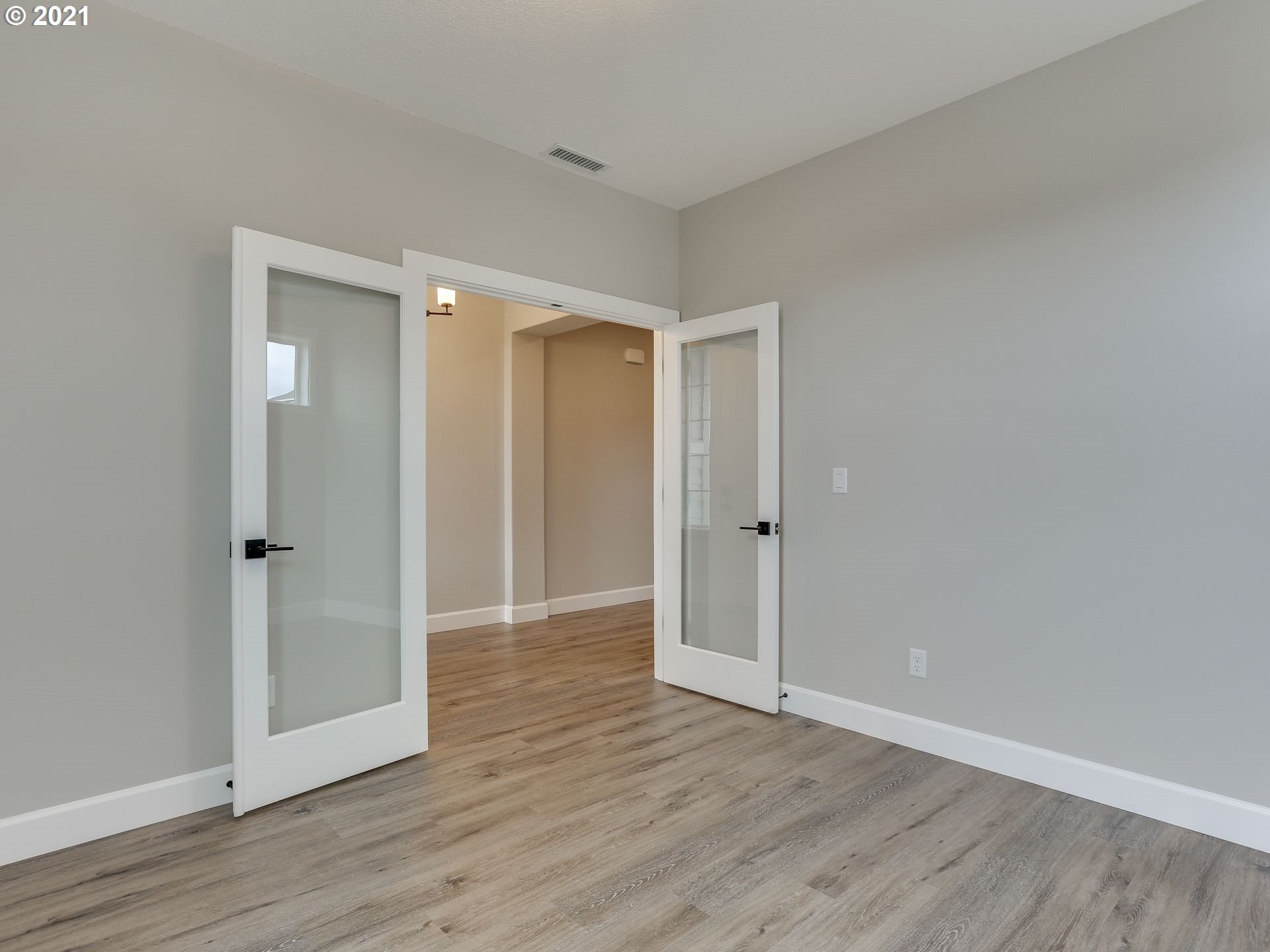 4128 South 17th Way Ridgefield, WA 98642 - Photo 6 of 21 a view of an empty room and wooden floor
