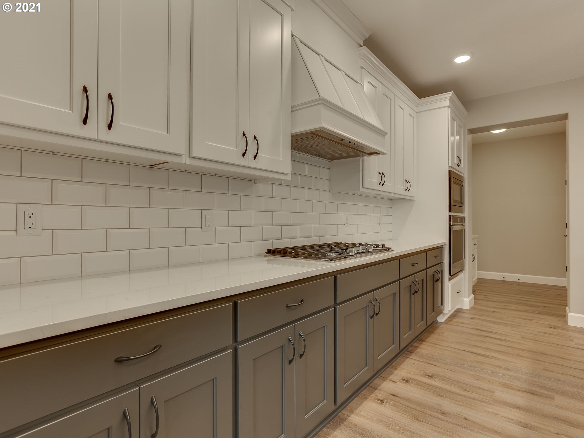4128 South 17th Way Ridgefield, WA 98642 - Photo 8 of 21 a kitchen with granite countertop white cabinets and white appliances