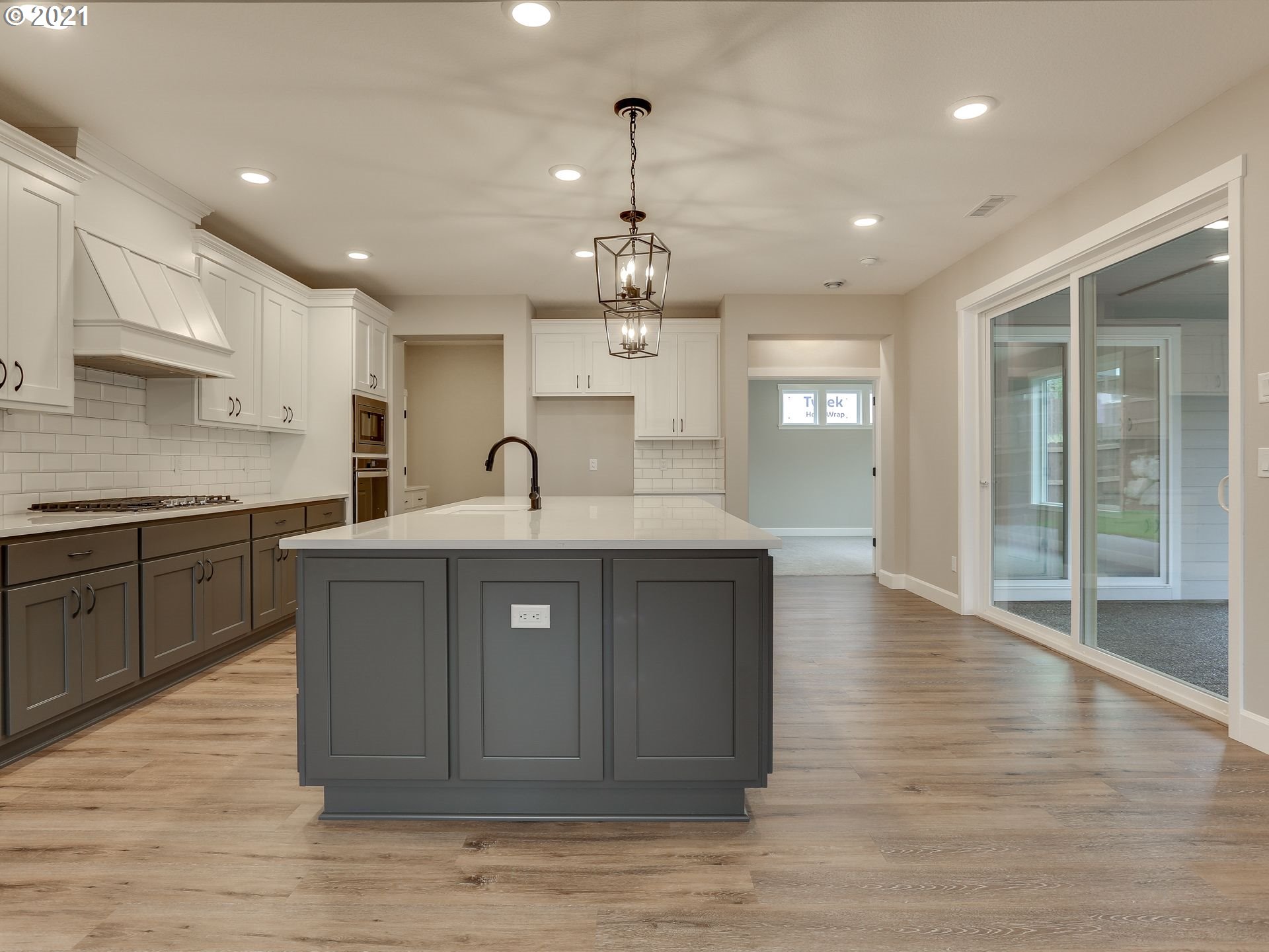 4128 South 17th Way Ridgefield, WA 98642 - Photo 9 of 21 a kitchen with kitchen island a sink stainless steel appliances and cabinets