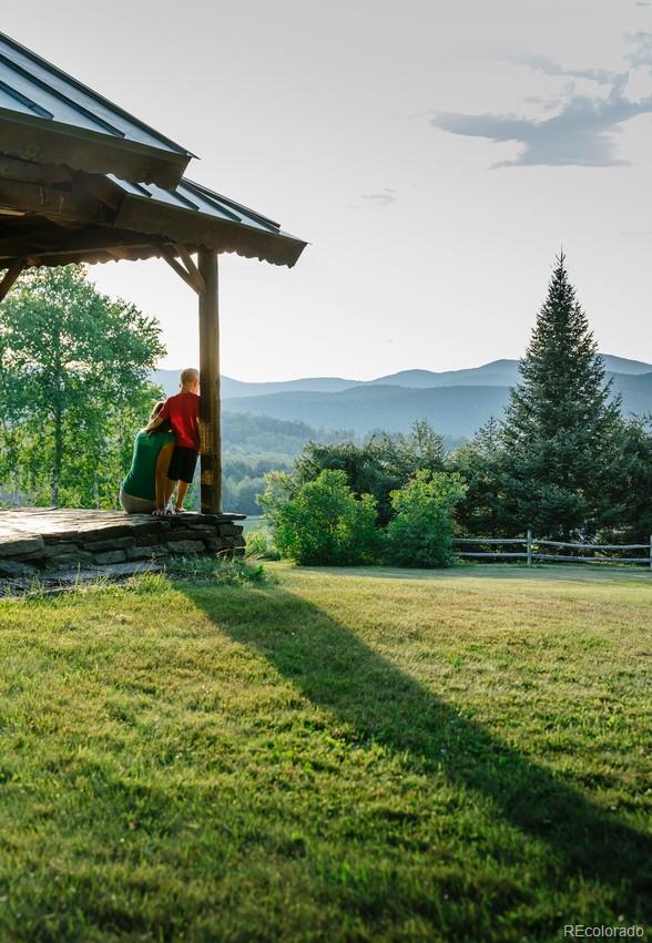 7142 Lynx Lair Road Evergreen, CO 80439 - Photo 1 of 7 a view of a mountain with a park