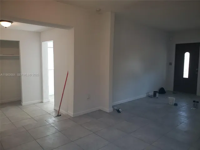a bathroom with a granite countertop sink toilet and bathtub