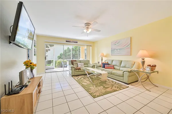 a living room with furniture and a flat screen tv