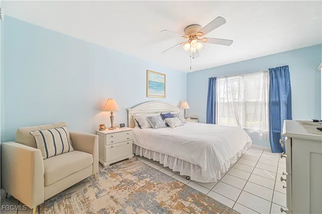 a bedroom with bed and a couch