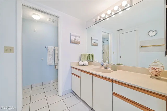 a bathroom with a sink a vanity and a mirror