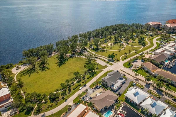 an aerial view of a house with a lake view