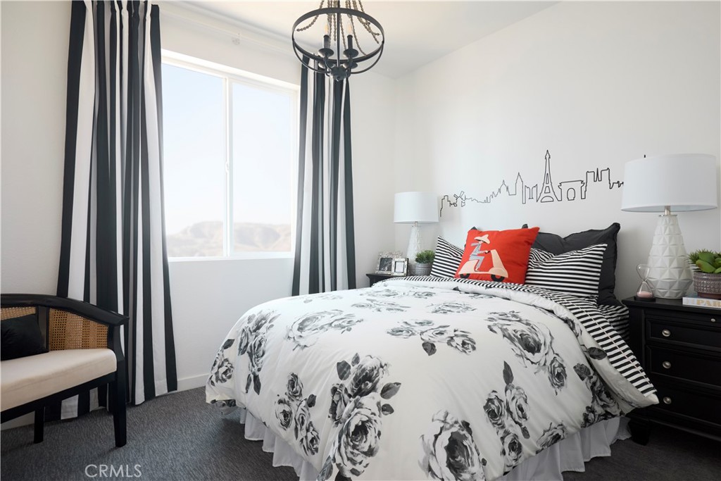 11531 Jack Street Beaumont, CA 92223 - Photo 11 of 16 a bedroom with bed and window