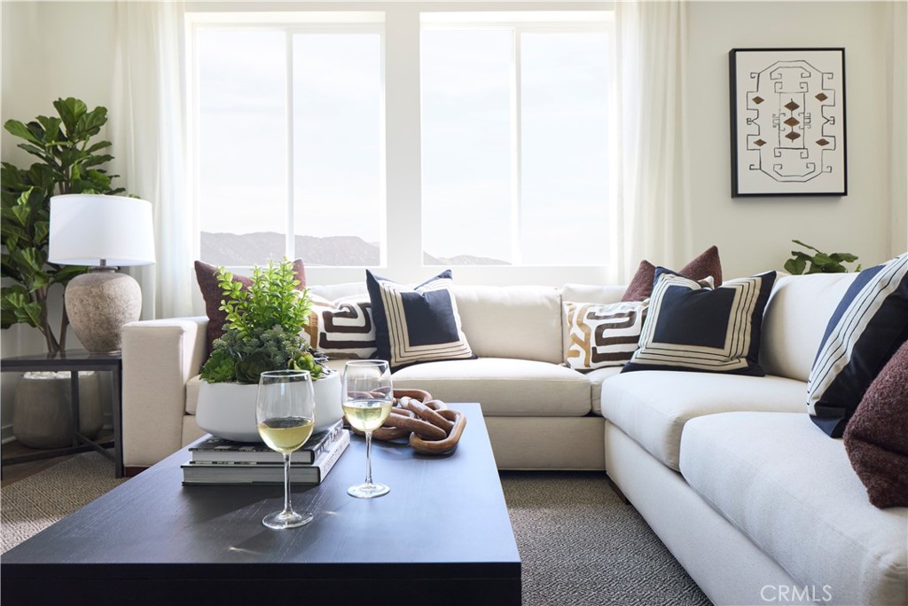 11531 Jack Street Beaumont, CA 92223 - Photo 2 of 16 a living room with furniture and a large window