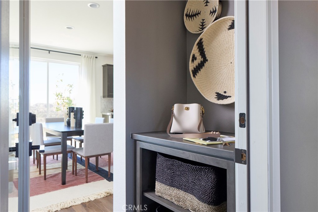 11531 Jack Street Beaumont, CA 92223 - Photo 6 of 16 a view of hall way with furniture and chandelier