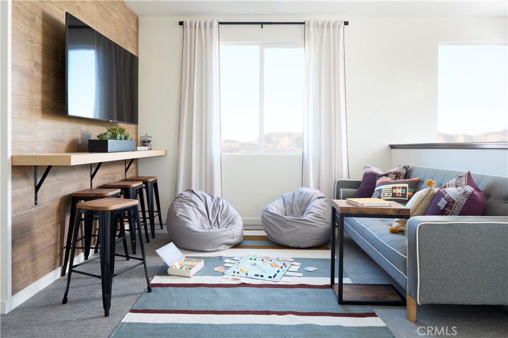 11531 Jack Street Beaumont, CA 92223 - Photo 7 of 16 a living room with furniture and a flat screen tv