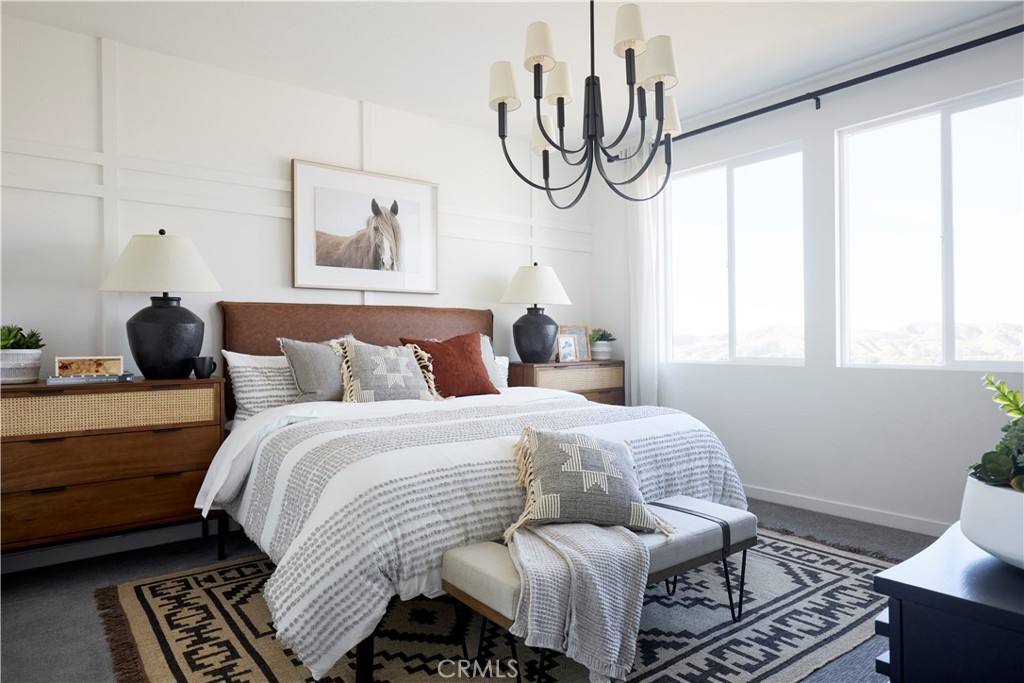 11531 Jack Street Beaumont, CA 92223 - Photo 8 of 16 a bedroom with a bed and wooden floor